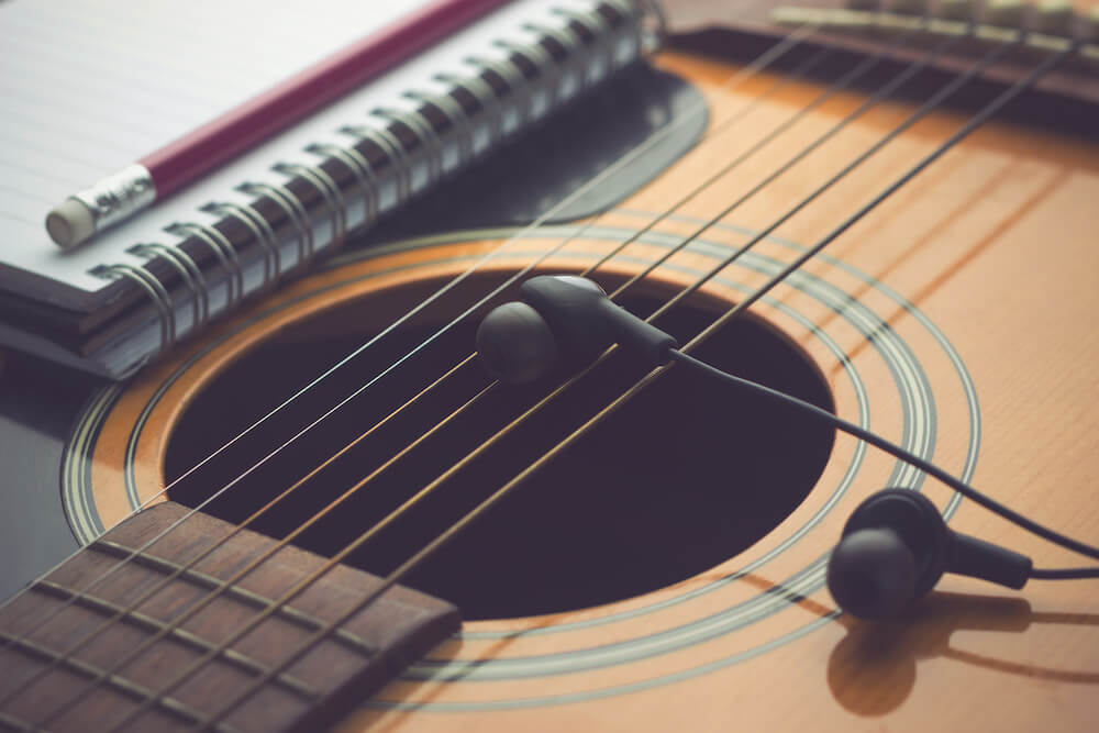 Headphones on guitar, Writing music
