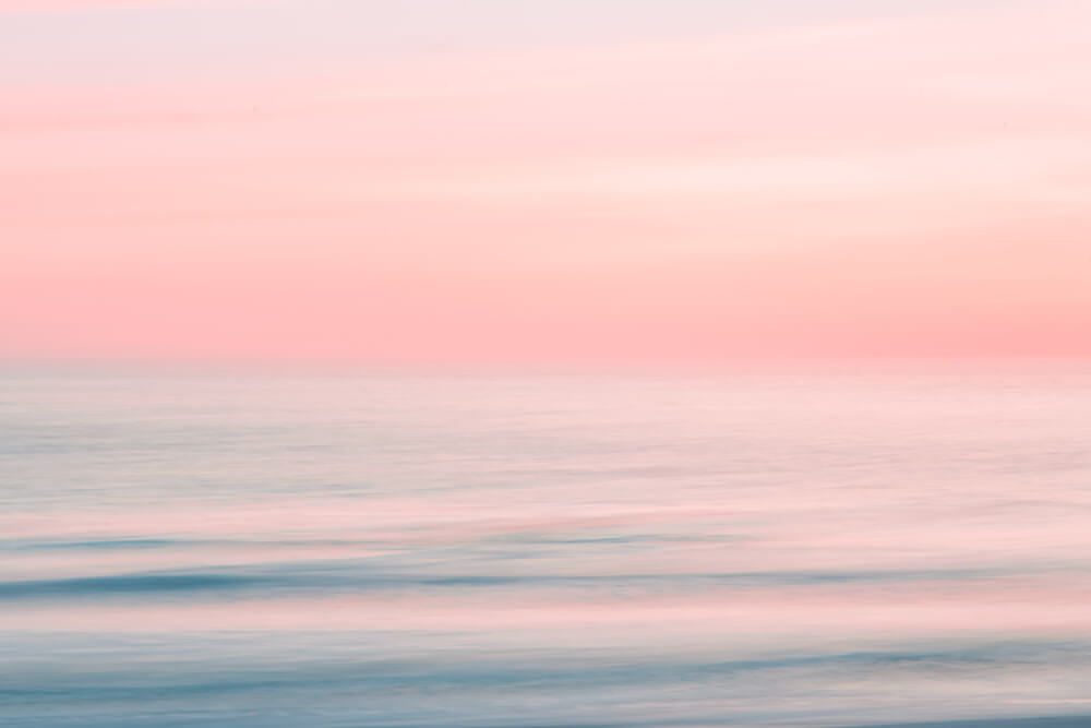 Abstract blurred sunrise sky and ocean nature background